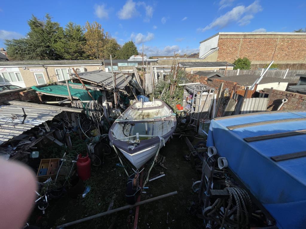 Lot: 140 - STORAGE YARD WITH POTENTIAL - Outside image of yard taken from top of front wall overlooking